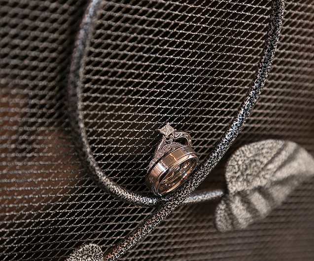 Silver ring on steel grate.