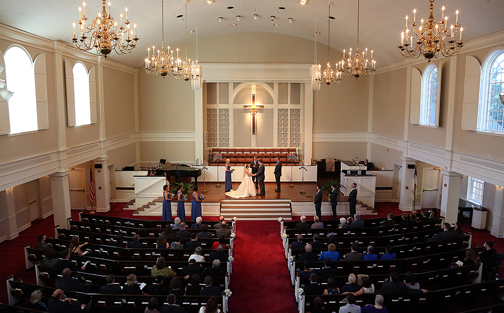 A beautiful wedding ceremony taking place in a church, filled with love, joy, and the presence of loved ones.
