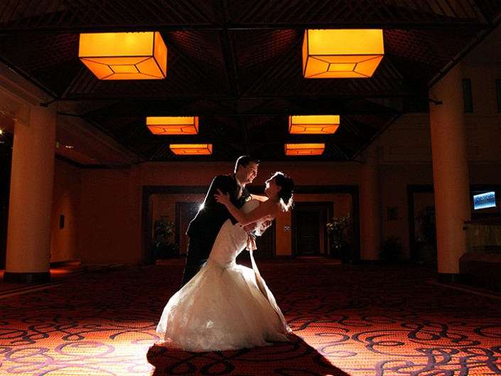 Couple celebrates wedding day in elegant, joyful room