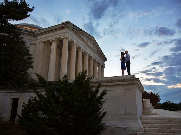 Romantic couple standing on building steps. Jefferson Memorial, Washington DC