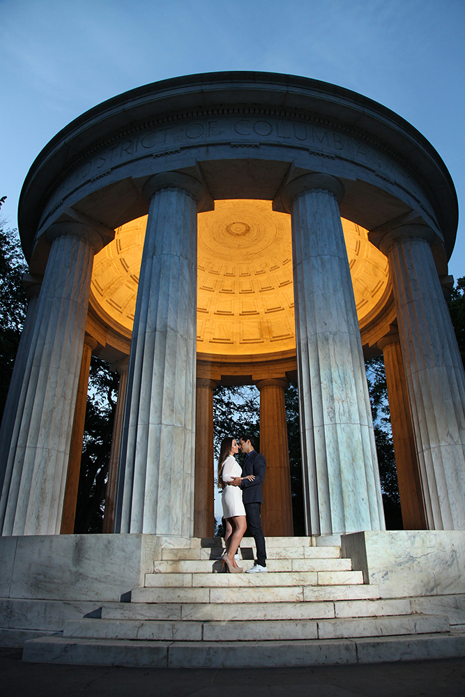 A couple posing in front of a majestic monument, expressing their love and admiration for the historical landmark.