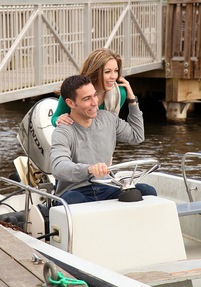 Couple enjoying a boat ride on the water.