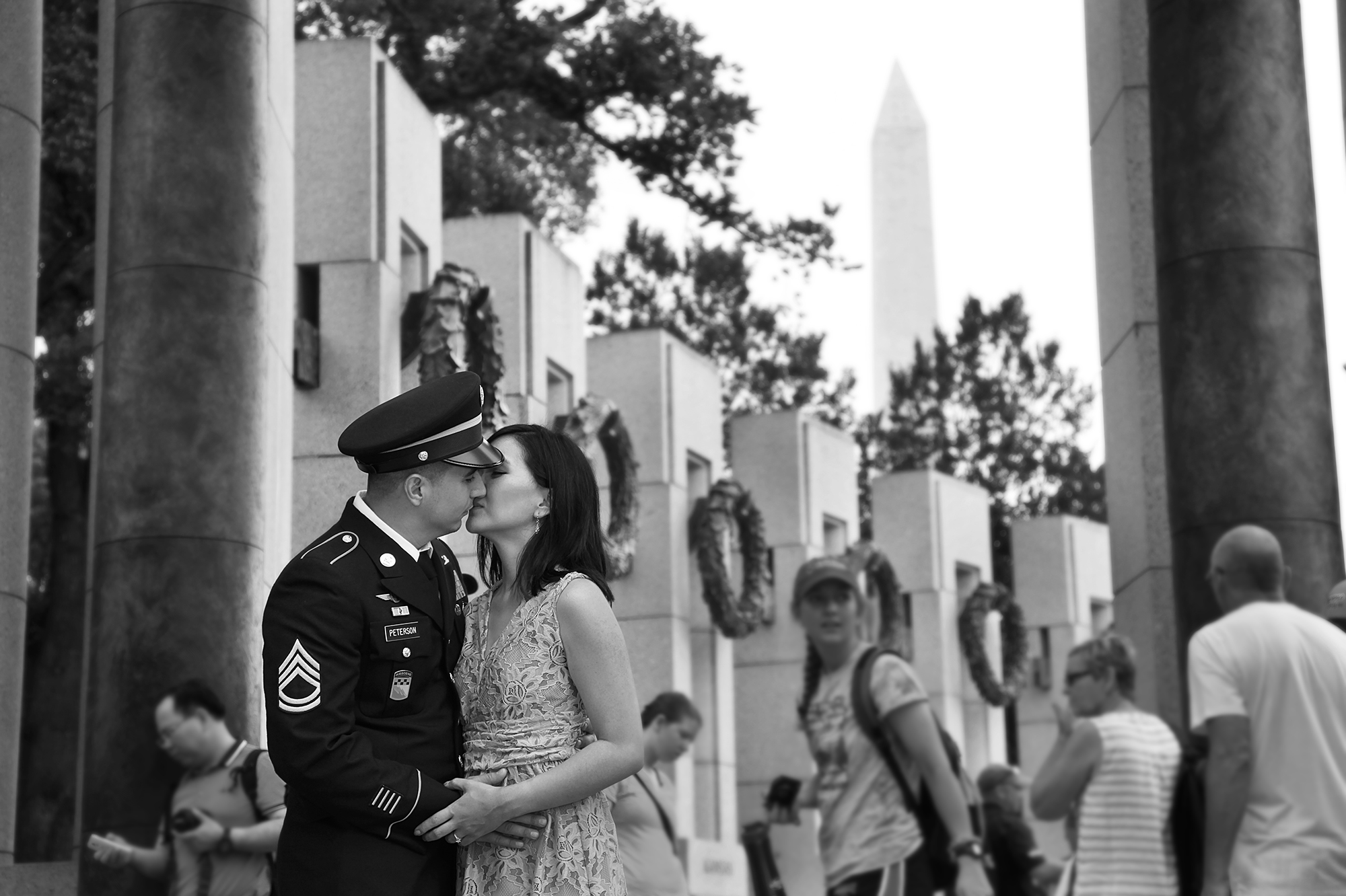Couple embracing in Washington DC during an engagement session, capturing their love and the city's iconic landmarks.