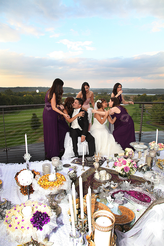 A group of bridesmaids posing for a picture at a wedding