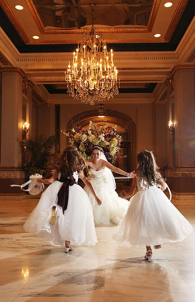Joyful bride and bridesmaids dancing with elegance.