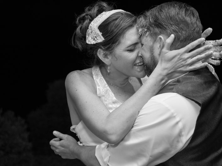 Bride and groom share heartfelt first dance embrace.