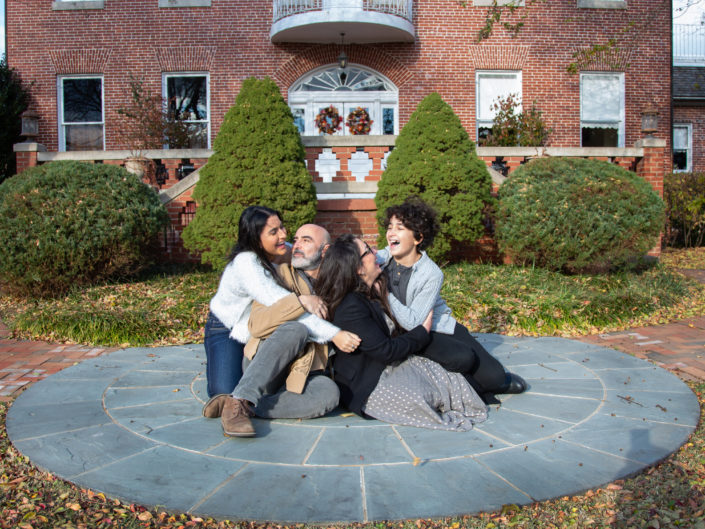 Family sitting together on a circular area, enjoying harmony. Kentlands Mansion, Maryland