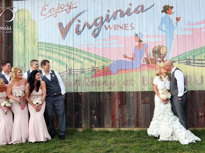 Wedding party at Virginia Winery, celebrating love in vineyards.