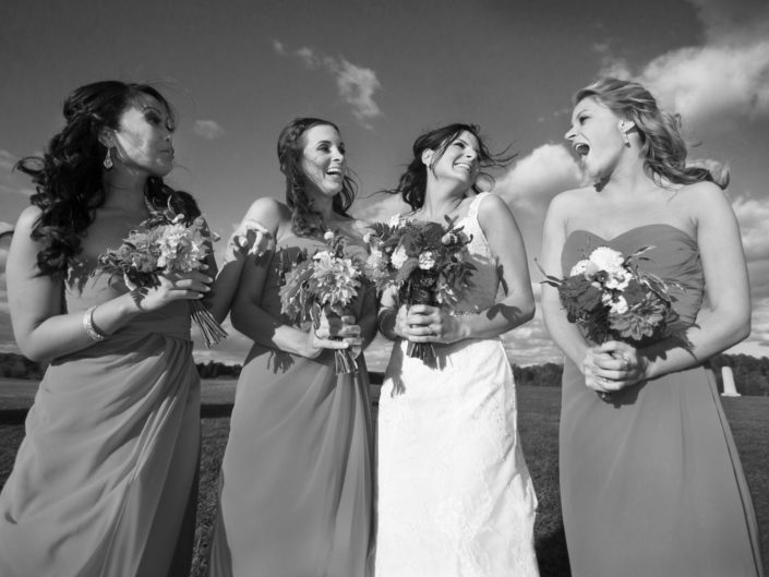 Bridesmaids in a vintage photo sharing a joyous moment