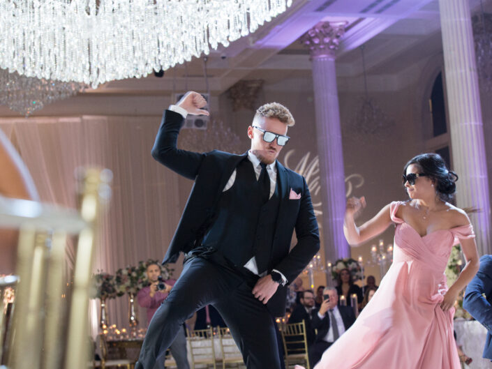 Wedding couple dancing with glasses on their eyes